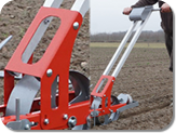 Handlebars to convert a unit to a manual seeder